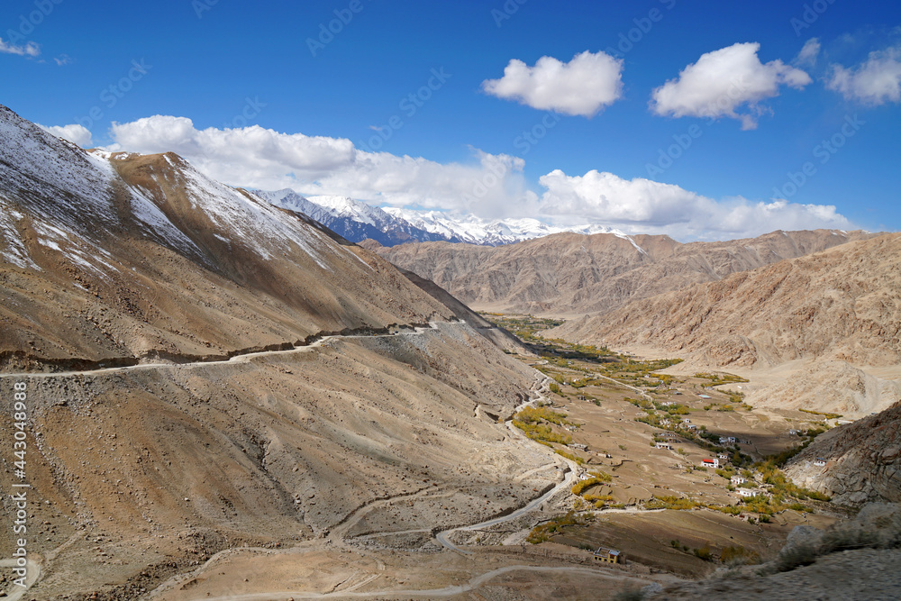 Landscape of Winding road along the snow mountain go to changla pass is a high mountain pass in Leh Ladakh, Jammu & Kashmir,India. It is claimed to be the second highest motor-able road in the world  