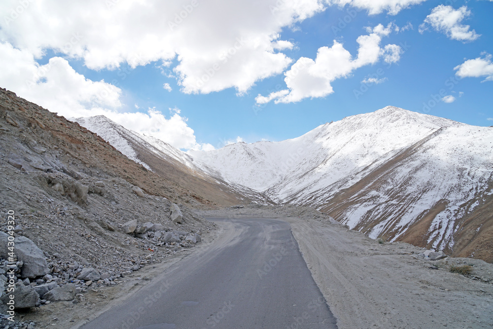 Landscape of Winding road along the snow mountain go to changla pass is a high mountain pass in Leh Ladakh, Jammu & Kashmir,India. It is claimed to be the second highest motor-able road in the world