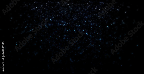Dust particles flying in the air Blue snowflakes on black background Can be used as overlay with blend mode (screen)