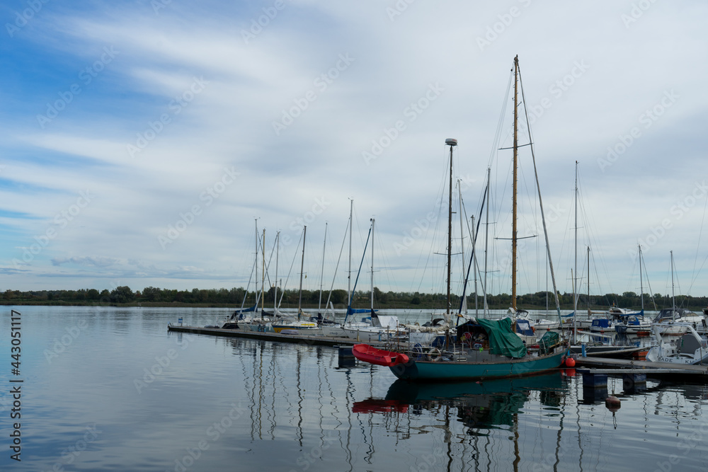 Fototapeta premium Tiny boats in the river Unterwarnow in the german city Rostock