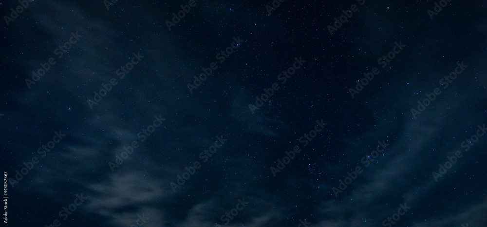 Lake Tillery night sky filled with stars and a few thin clouds floating by