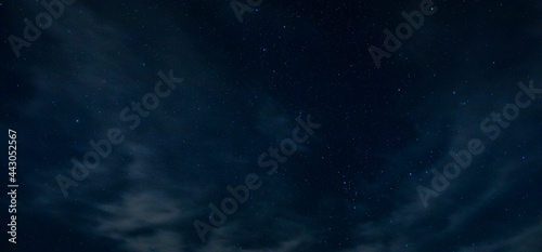 Obraz na płótnie Lake Tillery night sky filled with stars and a few thin clouds floating by w salonie
