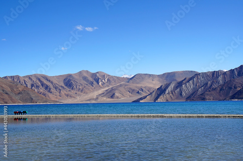 Landscape Lake Nature Scene of Pangong tso or Pangong Lake with Snow mountain background is best famous destination at Leh Ladakh ,Jammu and Kashmir , India - Blue nature travel  Background - travel © kittinit