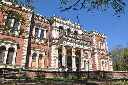 An ancient building. Manor house of a noble estate made of red bricks with white trim. The main house of the Bykovo estate. 