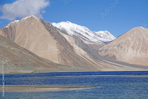 Landscape Nature Scene of Pangong tso or Pangong blue Lake with Himalaya Snow mountain background at Leh Ladakh ,Jammu and Kashmir , India  - unseen travel vacation park and outdoor