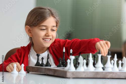 Cute little girl playing ch...