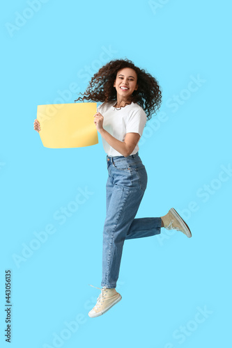 Jumping young woman with bl...