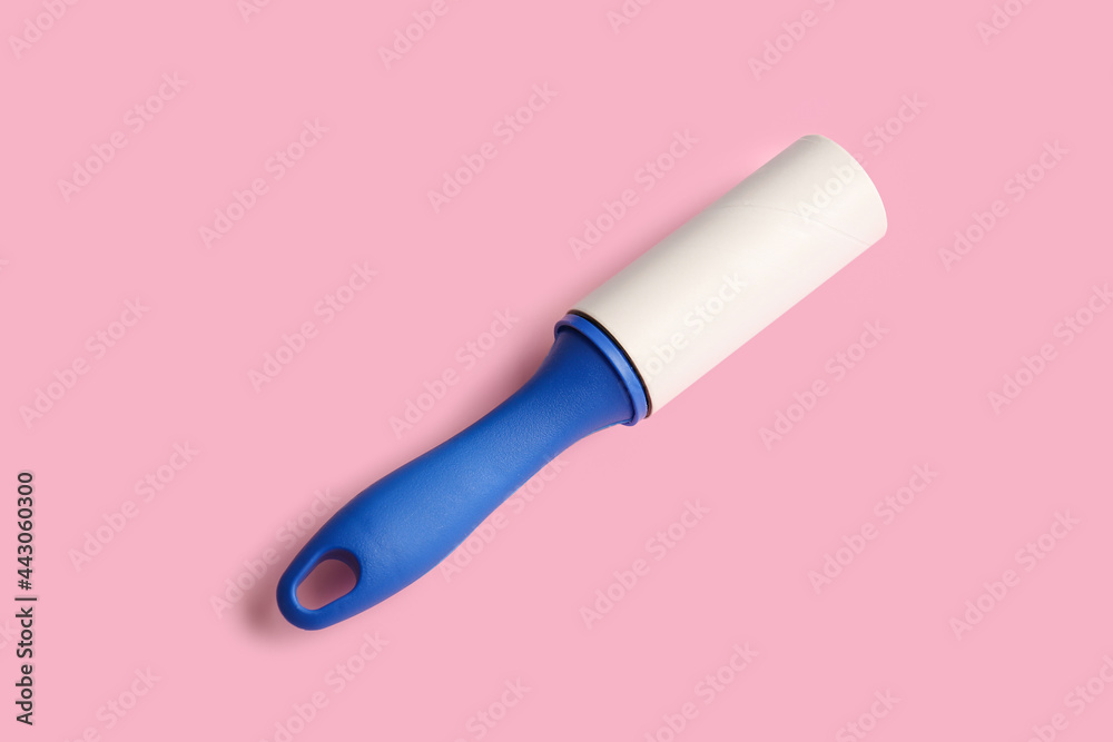 Lint roller on color background Lint roller on color background