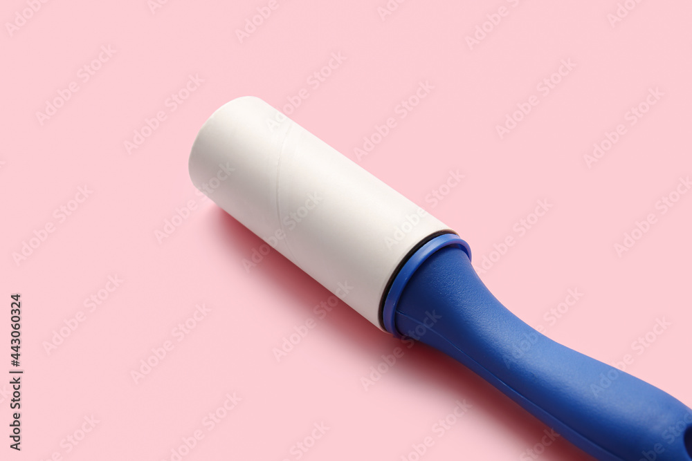 Lint roller on color background Lint roller on color background