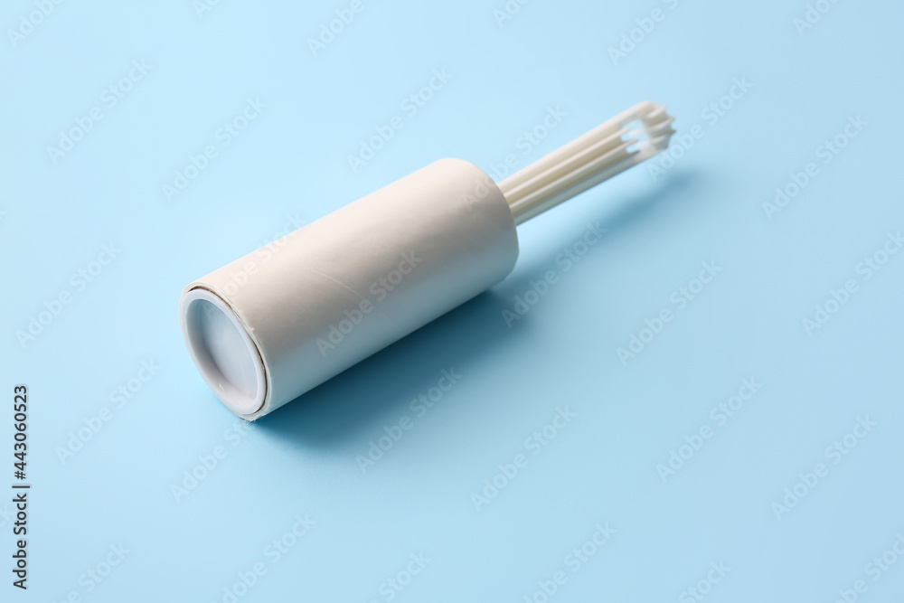 Lint roller on color background Lint roller on color background