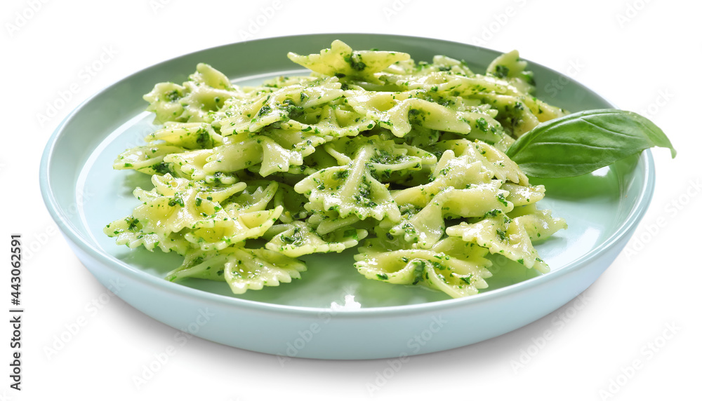 Plate with tasty pesto pasta on white background