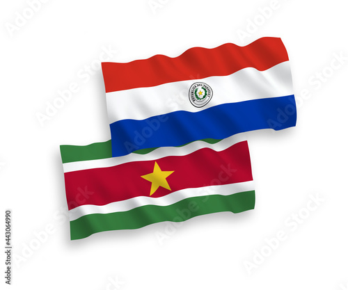 Flags of Republic of Suriname and Paraguay on a white background