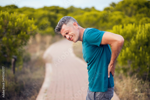 Back pain. Man with back injury. Healthcare and medicine concept