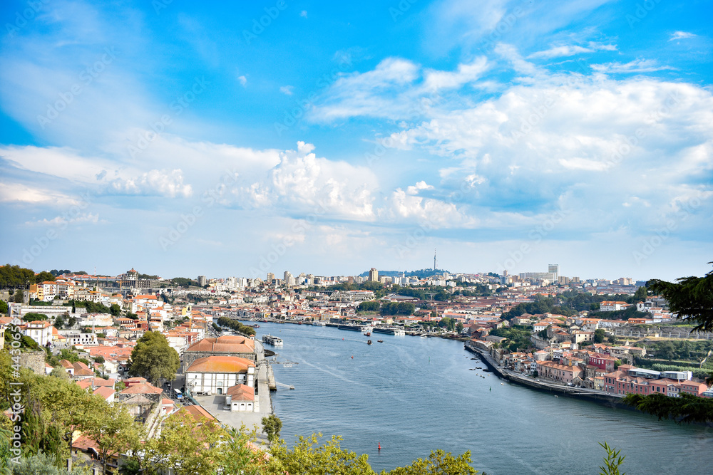 City of Porto around Duero river, Portugal. Sunny cloudy day