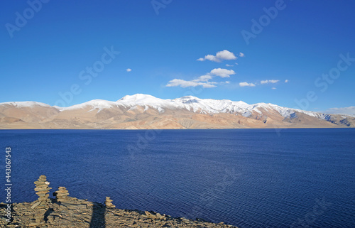 Landscape Tso moriri Lake and stone stack is Blue lake with Himalaya snow mountain background - Unseen natural scene at Leh Ladakh ,Jammu and Kashmir , India   photo