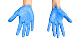Child's hand with blue paint on it isolated on a white background. 
Blue painted on a girl’s hands.