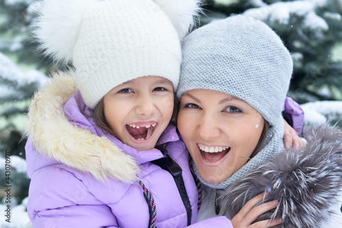 happy Mother and daughter in winter