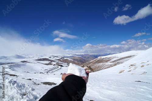 Nature Scene of white Snow in the hand with  himalaya snow mountain of High Roadway at tanglang la pass in winter season at Leh Ladakh , India photo