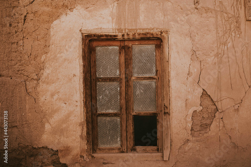 Broken window of old house