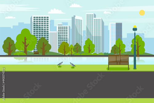 Public park with bench river city.Road on park with river and cityscape.Nature spring scene with city