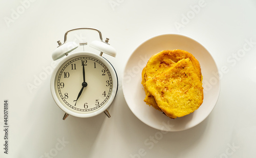 Delicious, quick and simple breakfast. a alarm clock and croutons