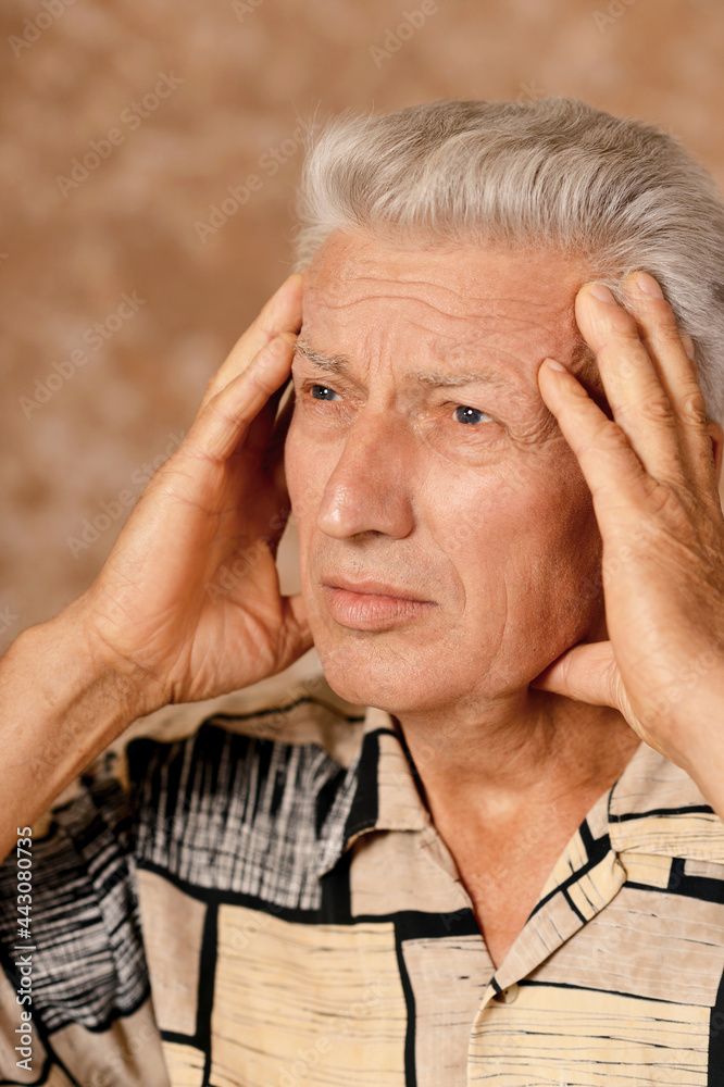 Portrait of sad sick senior man with headache Portrait of sad sick senior man with headache