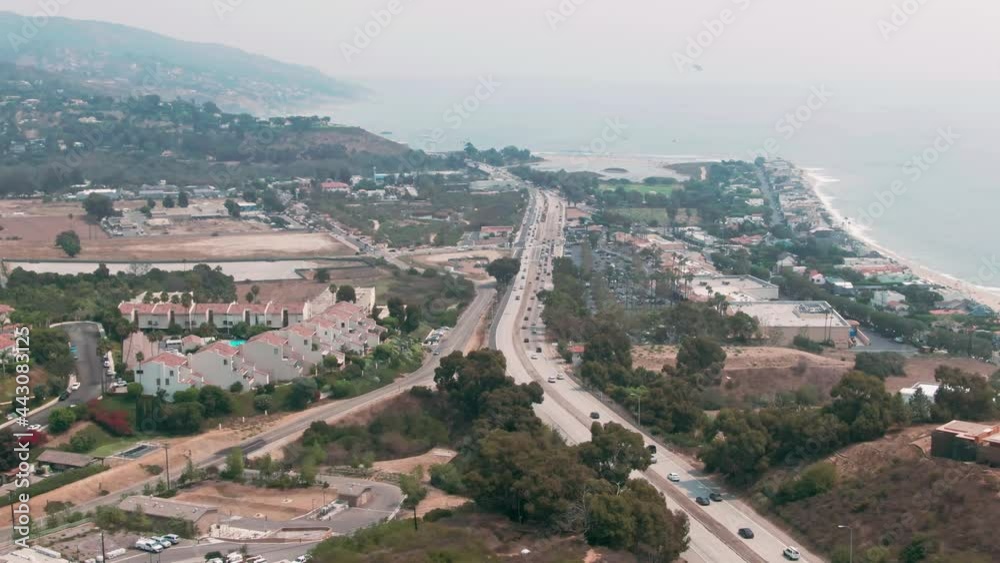 Aerial: Malibu coastline, pacific coast highway traffic and houses, Los Angeles, California, USA Aerial: Malibu coastline, pacific coast highway traffic and houses, Los Angeles, California, USA