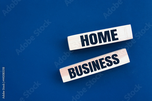 Home business symbol. Wooden blocks form the words 'home business' on beautiful grey background. Home business concept. Copy space.