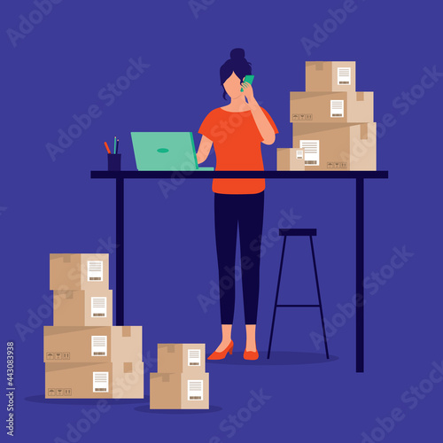 Young Female Small Business Owner Working With Laptop And Smartphone Preparing Package For Delivery. E-Commerce. E-Business.