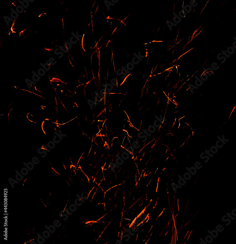 Sparks from fire on a black