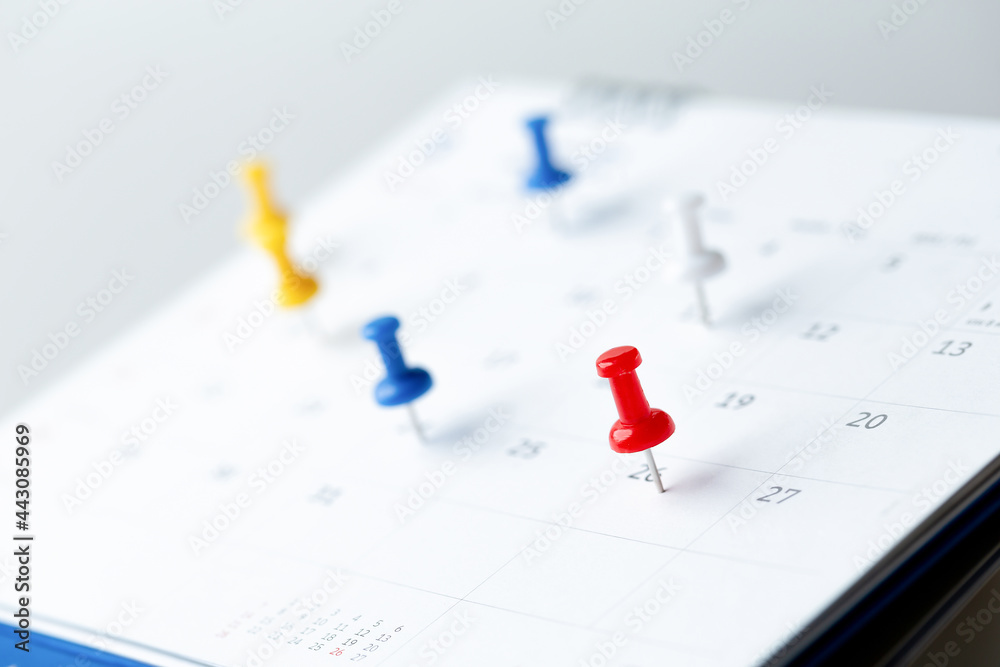 Thumbtack in calendar concept for busy, appointment and meeting reminder, planning for business meeting or travel planning concept.