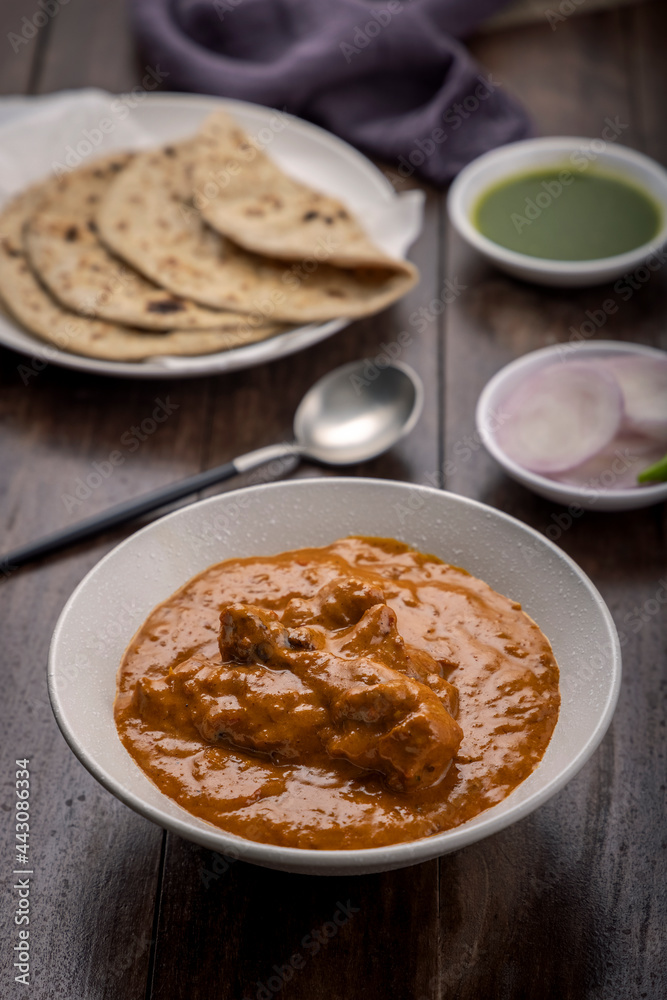 chicken butter masala served with flatbed roti or chapati chicken butter masala served with flatbed roti or chapati