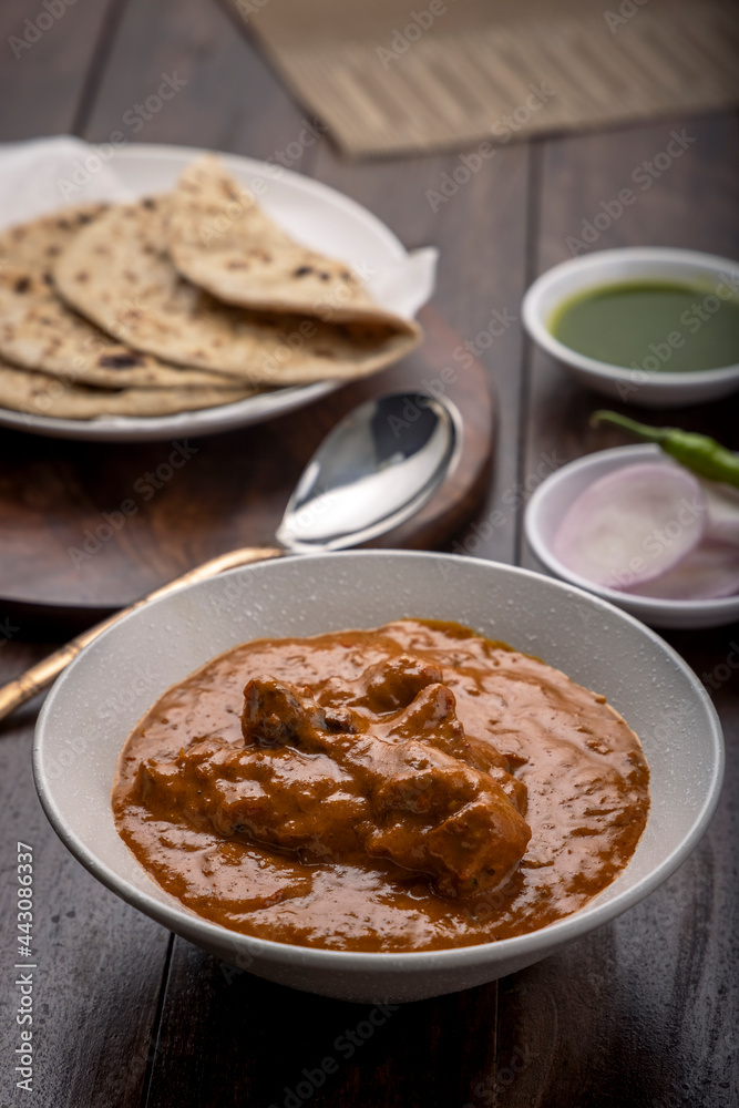chicken butter masala served with flatbed roti or chapati chicken butter masala served with flatbed roti or chapati