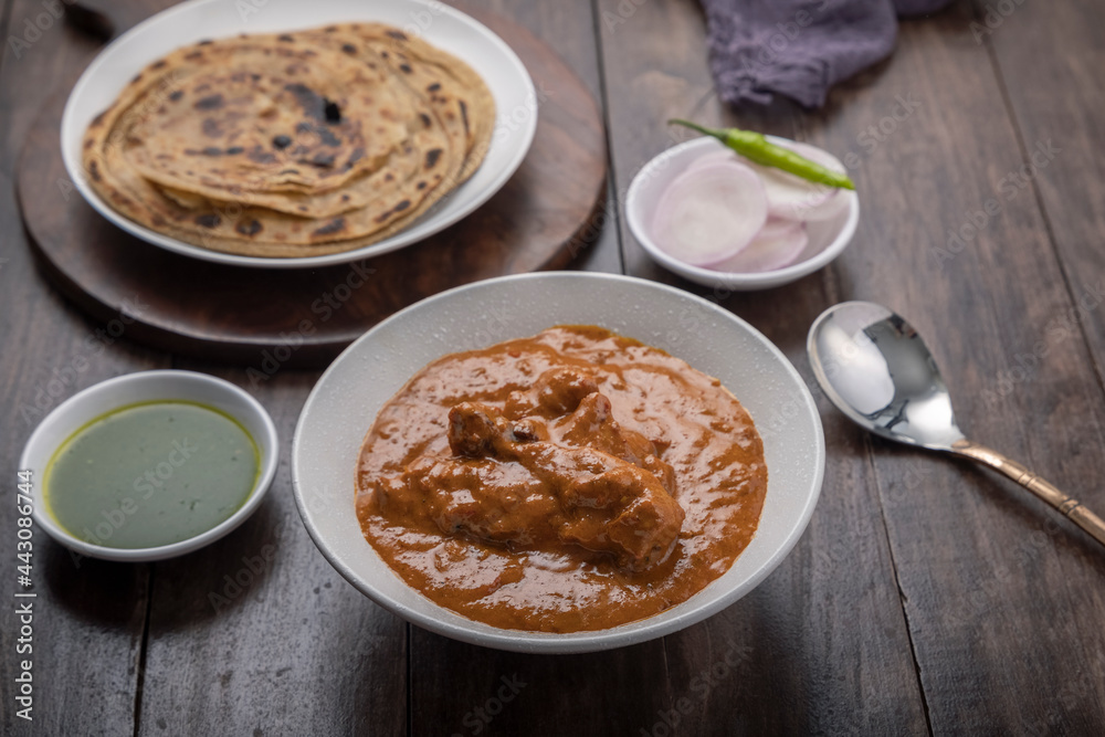 chicken butter masala served with lachha parantha chicken butter masala served with lachha parantha