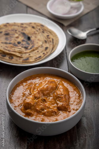 chicken butter masala served with lachha parantha