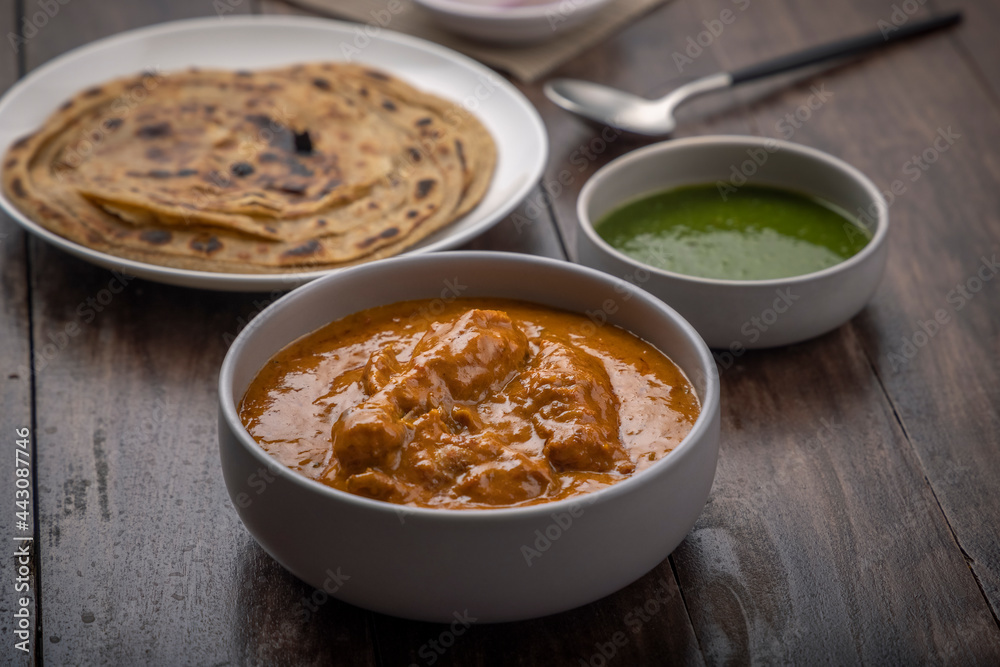 chicken butter masala served with lachha parantha chicken butter masala served with lachha parantha