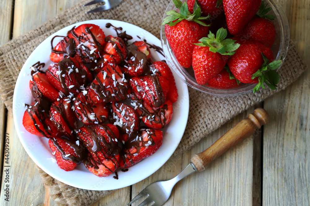 Strawberries with chocolate on a plate. Fresh juicy strawberries. Summer healthy dessert. Strawberries with chocolate on a plate. Fresh juicy strawberries. Summer healthy dessert.