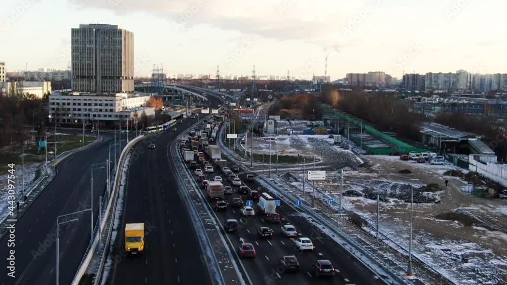 Daytime road traffic and railway tracks. Travel in the city. Urban traffic jams aerial view Daytime road traffic and railway tracks. Travel in the city. Urban traffic jams aerial view