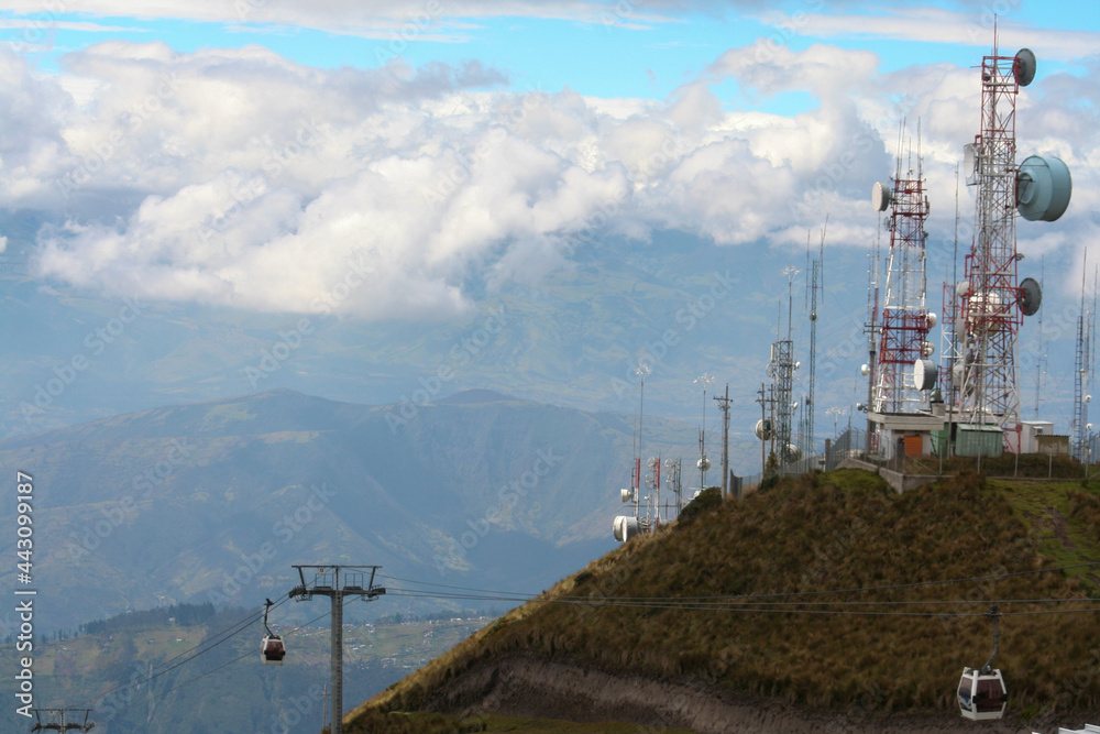 landscape with mountain, antennas, sky and clouds near Quito, Ecuador