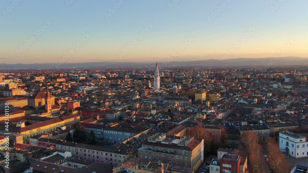 modena cityscape aerial shot at sunset drone flying backwards over city centre at dusk ,emilia romagna italy 4k modena cityscape aerial shot at sunset drone flying backwards over city centre at dusk ,emilia romagna italy 4k