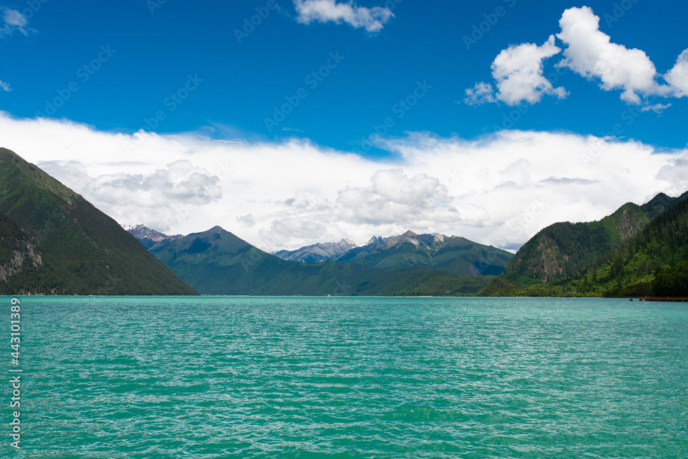 Crystal Clear Glacial Water and Snowy Peaks at Pagsum Lake in Nyingchi, Tibet Autonomous Region Crystal Clear Glacial Water and Snowy Peaks at Pagsum Lake in Nyingchi, Tibet Autonomous Region