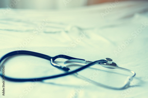 Selective focus to black stethoscope. Stethoscope for doctor checkup on health medical laboratory. Medical concept image.