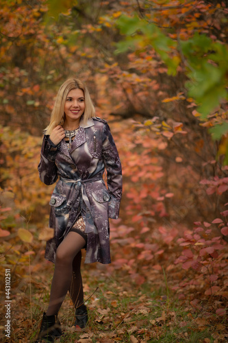 beautiful girl in autumn beautiful foliage in the forest in the tunnel