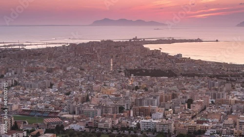 trapani city aerial view time lapse from day to night,view of the sicilian town at sunset,sun sets over the sea 4k photo