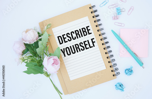 Notepads on the white background. Text DESCRIBE YOURSELF