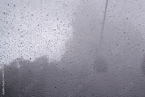 View of the cable car cabin in the fog through the glass in the raindrops