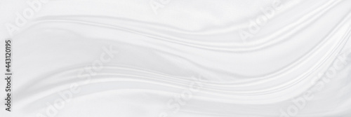 White gray satin texture that is white silver fabric silk panorama background with beautiful soft blur pattern natural.