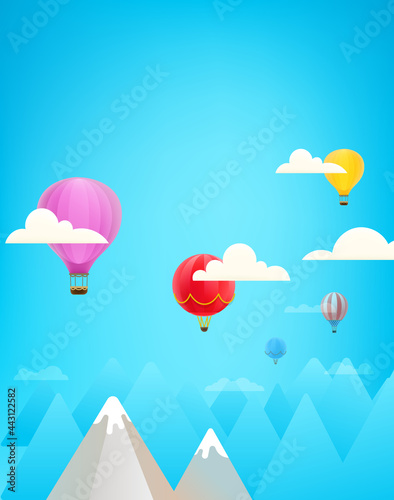 Color air balloons in a sky above mountains. Vectical composition with copy space