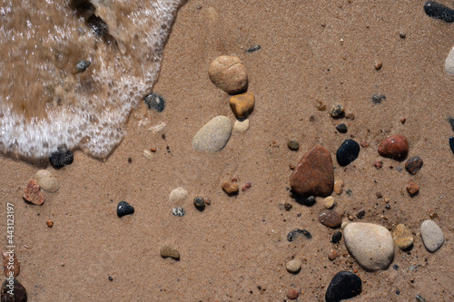 Fototapeta Naklejka Na Ścianę i Meble -  wet beach on the shores of the Baltic Sea have pebbles of different colors