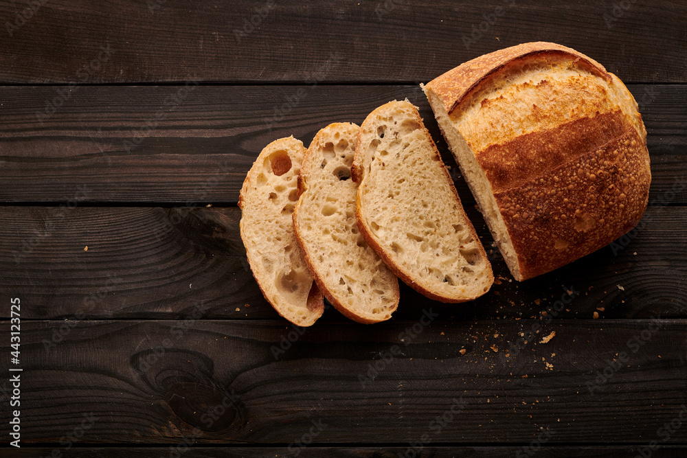 Homemade tartine bread on dark wooden table